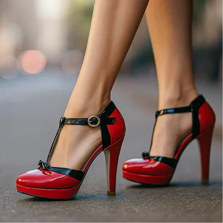 Estelle tie-strap heels in wine red patent leather with black ankle strap and bow detail