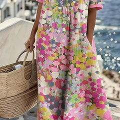 Pink floral midi dress with short sleeves and flowy skirt, mid-calf hem