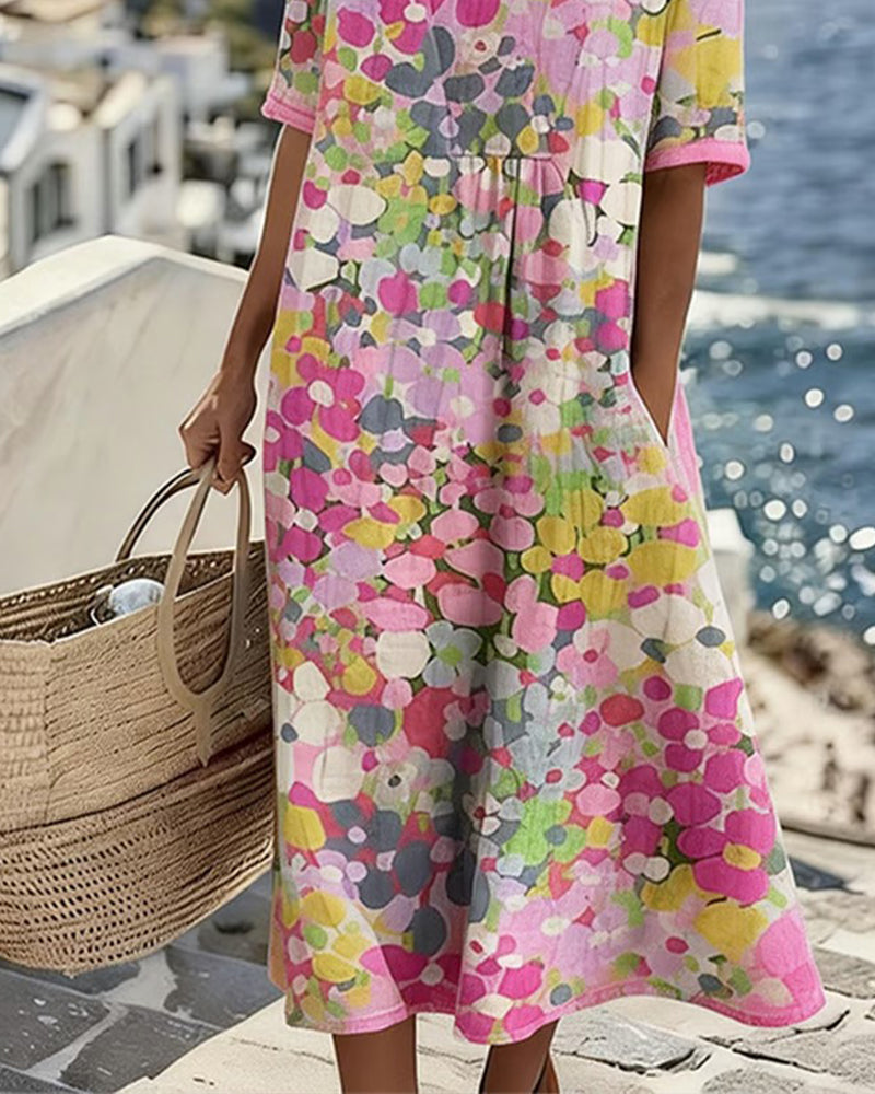 Pink floral midi dress with short sleeves and flowy skirt, mid-calf hem