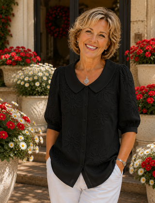 Black floral embroidered blouse with round collar and short puff sleeves