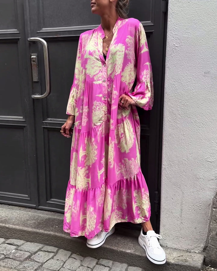 Flowing long pink printed dress with V-neck, button front, tiered skirt