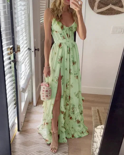 Green floral maxi dress with spaghetti straps, cinched waist, and tiered ruffle hem