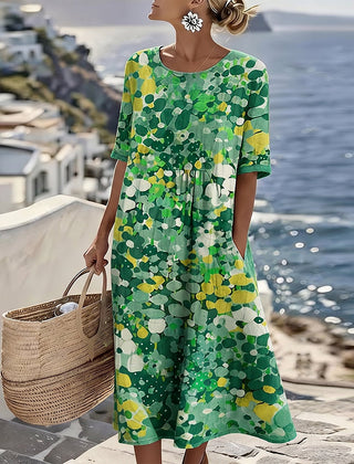 Green floral summer midi dress with short sleeves, round neckline, gathered waist
