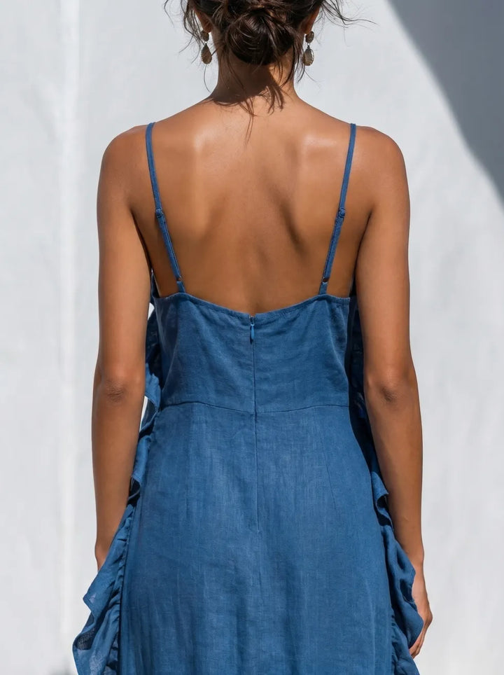 Backless blue maxi dress with spaghetti straps and ruffled side panels