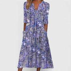 Blue patterned summer dress with V-neck and visible center button placket