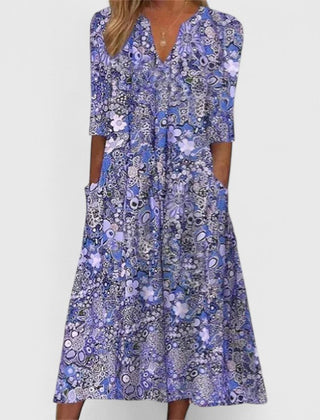 Blue patterned summer dress with V-neck and visible center button placket