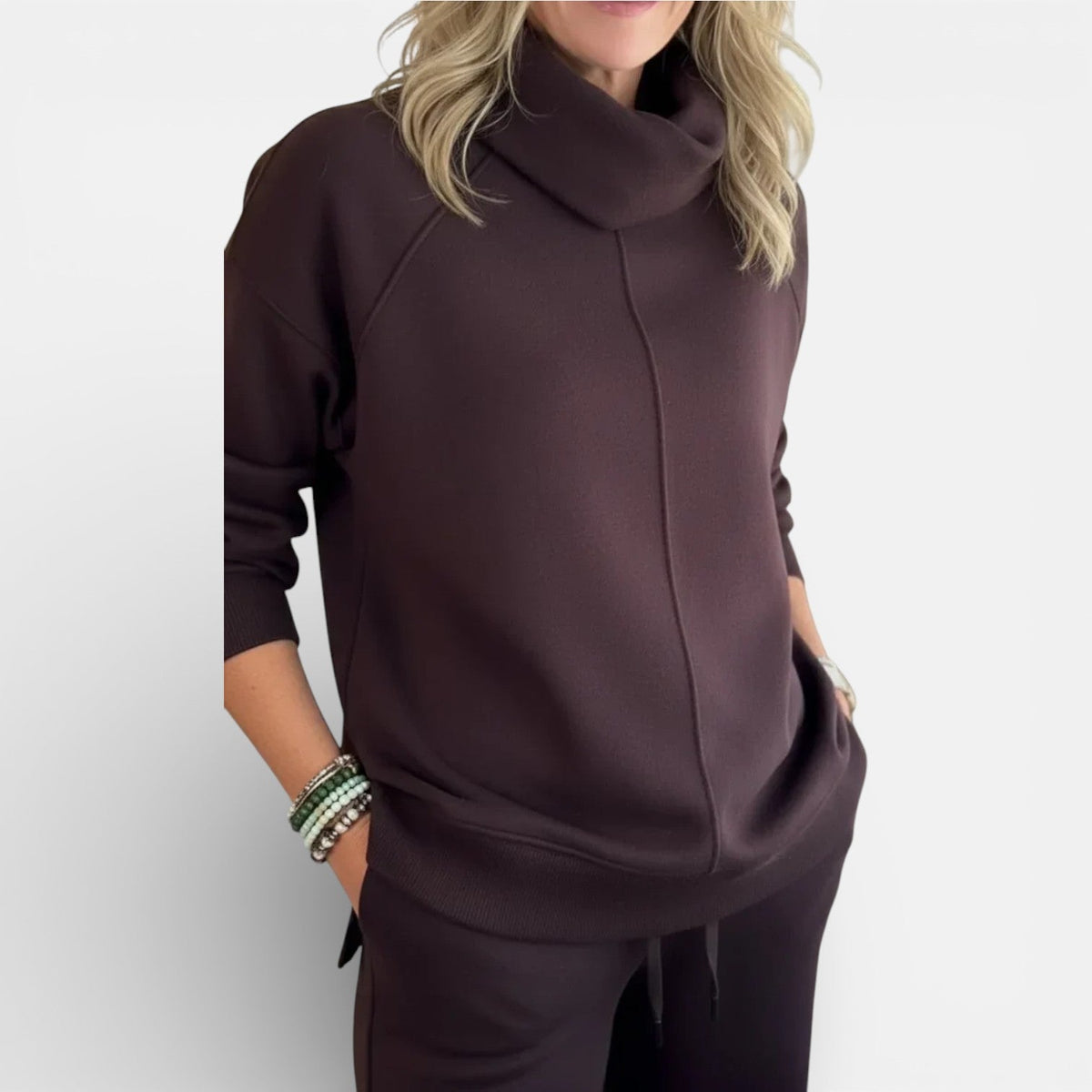 Burgundy two-piece lounge set close-up: hooded pullover and matching pants