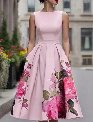 Blush pink sleeveless midi dress with fitted bodice and full skirt, large pink floral print