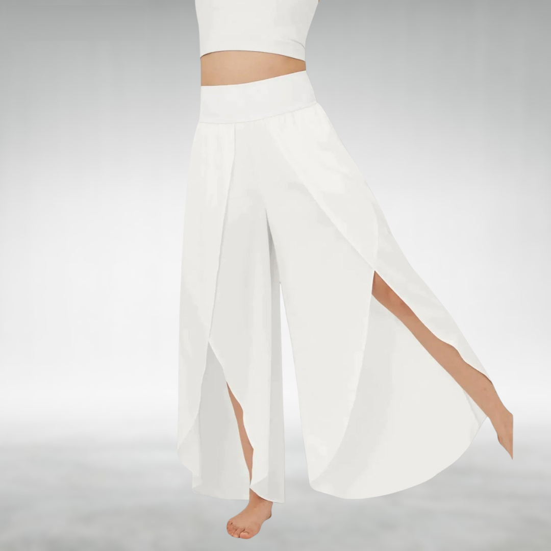 White wide-leg pants with elastic waist and flowing draped side slit legs