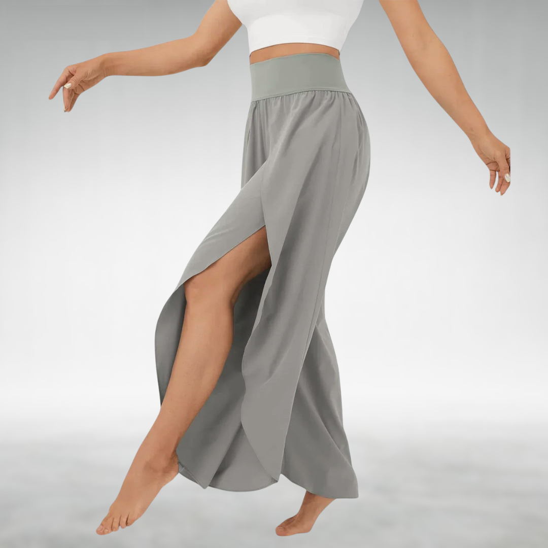 Gray wide-leg pants with elastic waist and flowing side slit drape