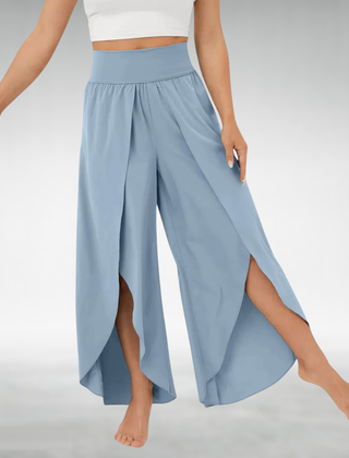 Light blue wide-leg pants with elastic waist and flowing side slit legs