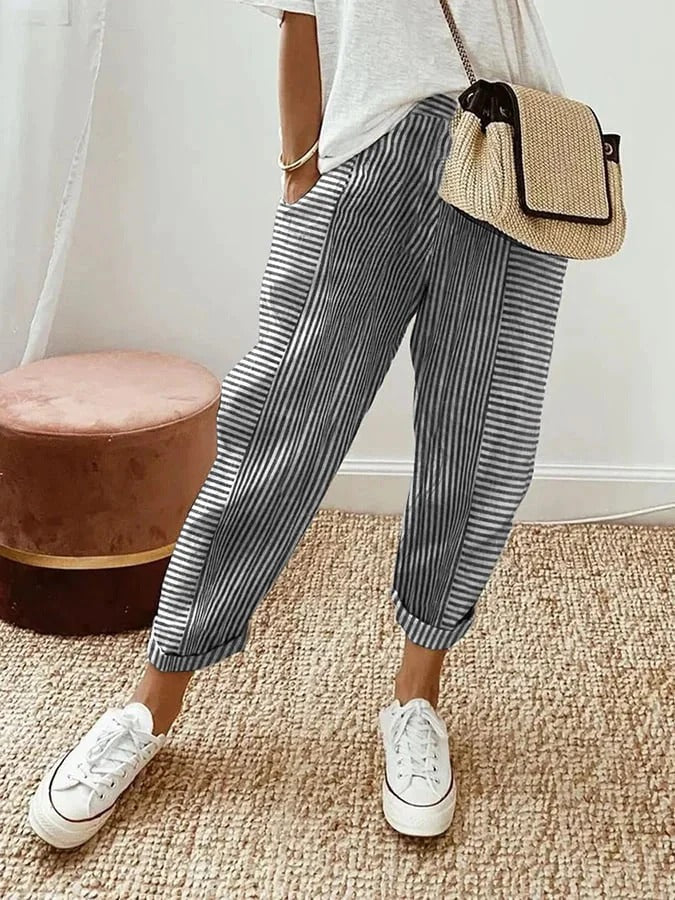 Blue striped trousers with wide legs and cuffed ankle hems