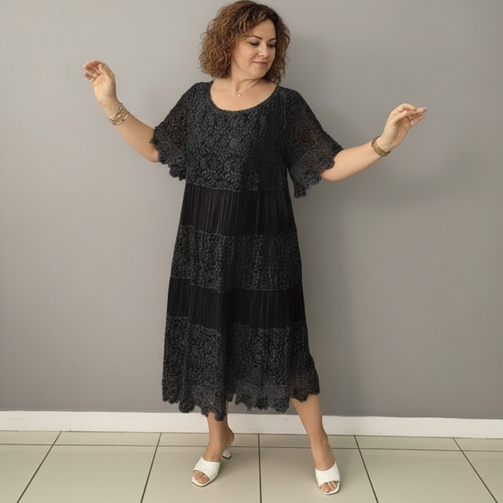 Black lace midi dress with tiered skirt and scalloped hem detail