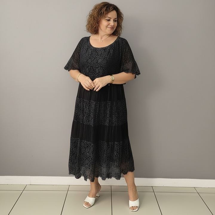 Black lace dress, front view, tiered ruffles with short sleeves