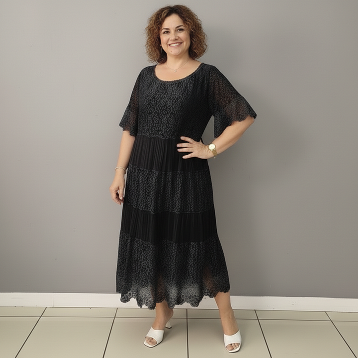 Black tiered lace midi dress with short flutter sleeves and round neckline