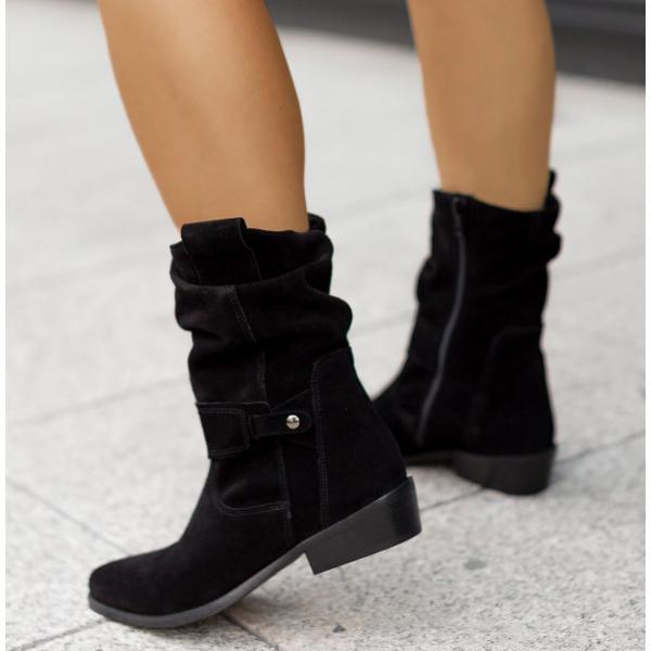 Black suede-style ankle boots with side zipper, buckle detail, and block heel