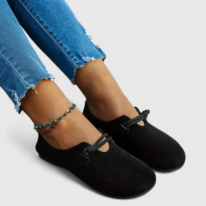 Black orthopedic loafer slip-on with adjustable front strap and round toe