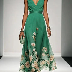 Green sleeveless V-neck floral dress with draped waist and full flowing midi skirt