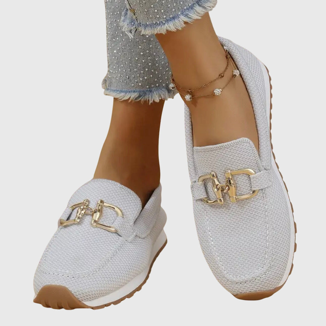 White mesh orthopedic loafers with gold buckle ornament and treaded sole