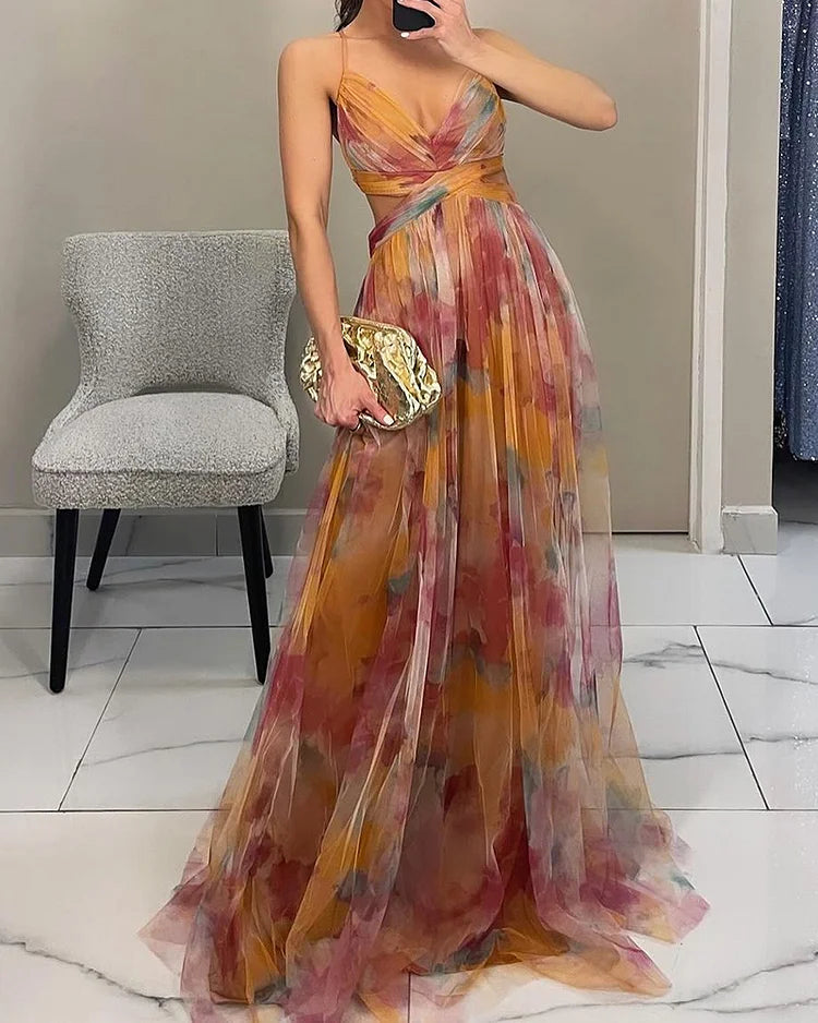 Halter print maxi dress in warm tones, V-back and long flowing pleated skirt