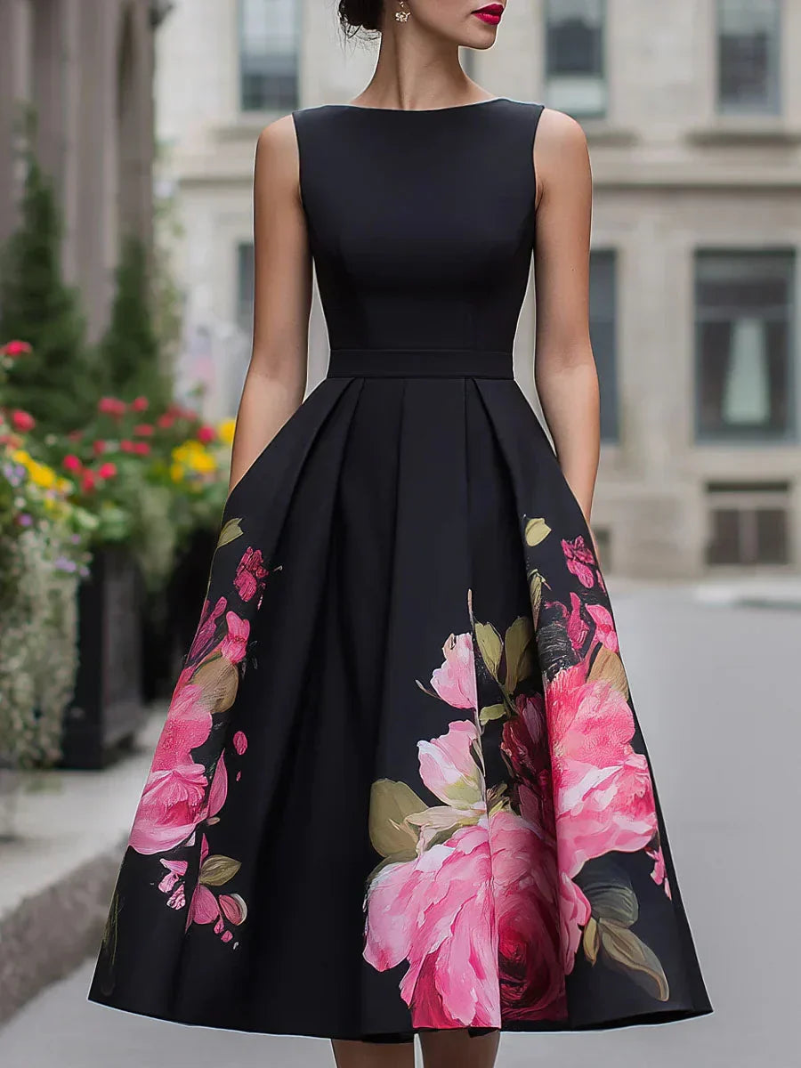Black sleeveless midi dress with fitted bodice and full skirt, pink floral print panels