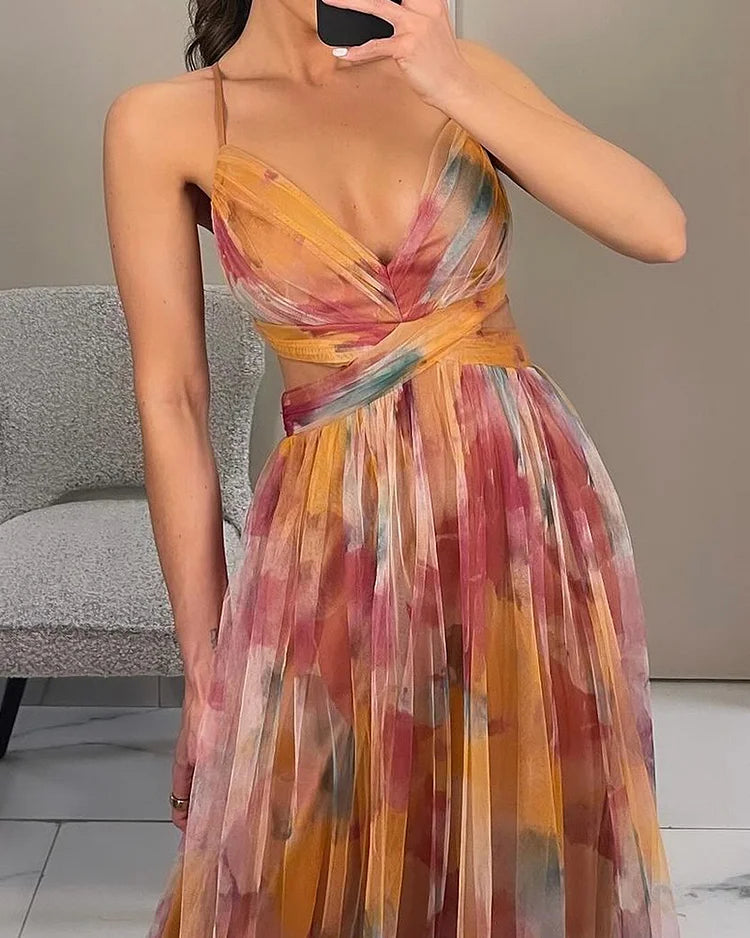Front view halter print maxi dress with crisscross bodice and bow at waist