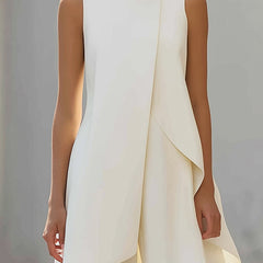 White sleeveless tailored vest top with draped asymmetric layer; matching pants