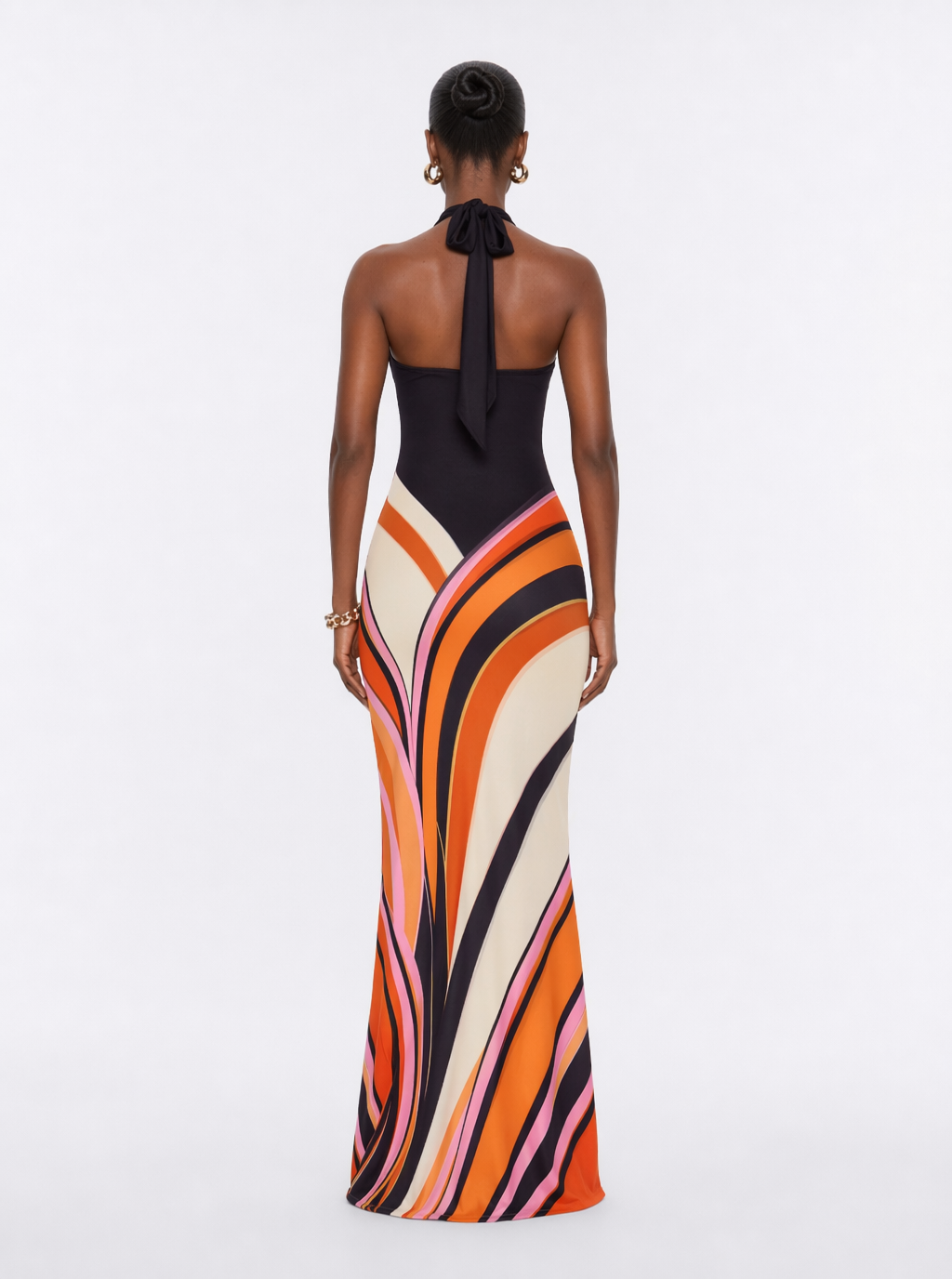 Back-view halter maxi dress with black tie-neck and geometric stripe skirt
