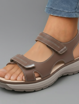 Brown orthopaedic support sandal with adjustable hook-and-loop straps and cushioned sole