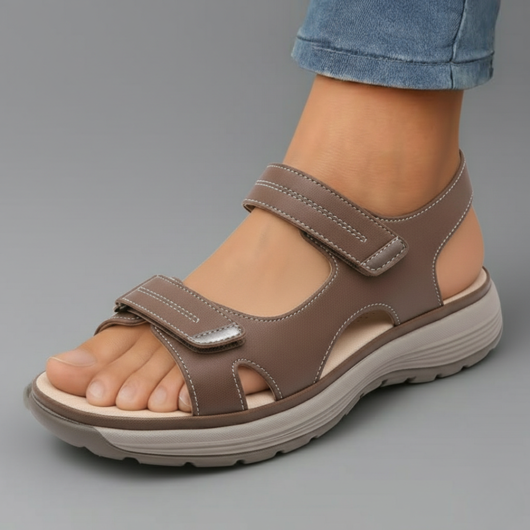 Brown orthopaedic support sandal with adjustable hook-and-loop straps and cushioned sole