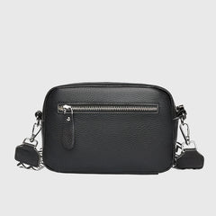 Black leather crossbody bag with front zipper and silver-tone hardware