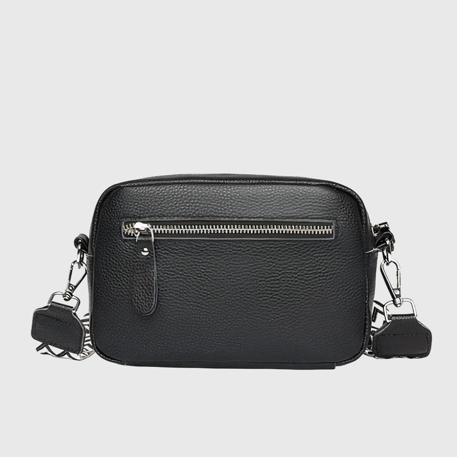 Black leather crossbody bag with front zipper and silver-tone hardware