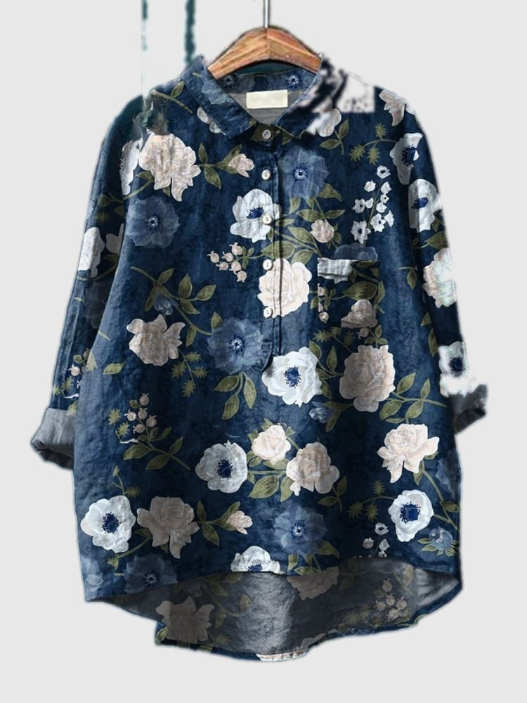 Blue floral button-up shirt with long sleeves and collar