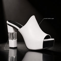 White peep-toe mules with clear sculpted block heel and black platform