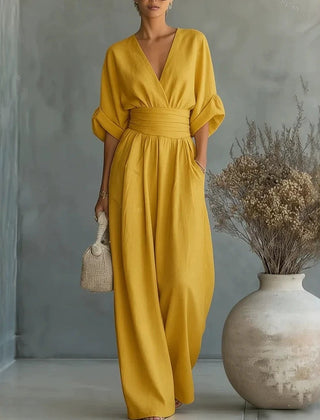 Women’s wide-leg jumpsuit in mustard yellow with V-neck and gathered waist