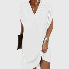 White draped V-neck dress with short sleeves and wrap-like crossover front