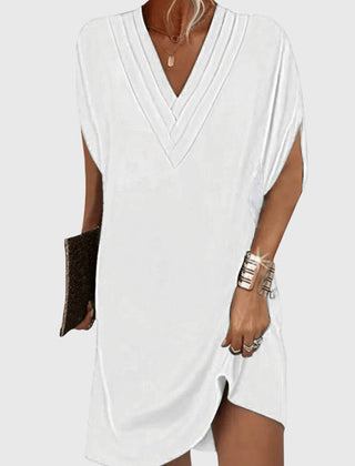 White draped V-neck dress with short sleeves and wrap-like crossover front