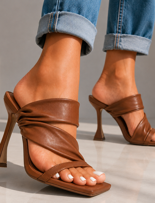 Caramel brown heeled sandals with open toe and twisted front straps