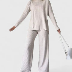 Ribbed knit two-piece set in light tone, with turtleneck top and wide-leg pants