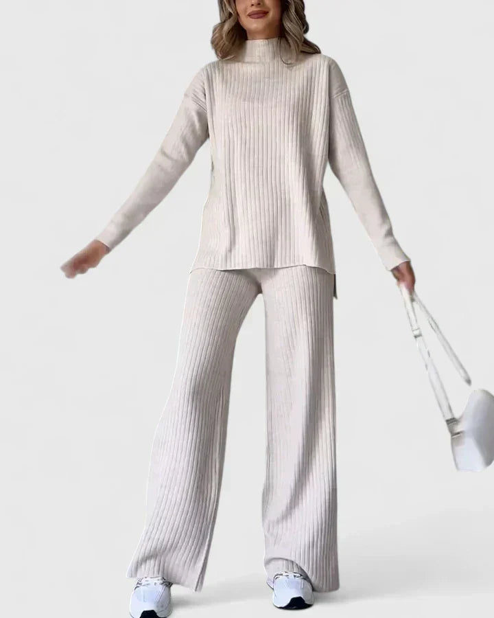 Ribbed knit two-piece set in light tone, with turtleneck top and wide-leg pants