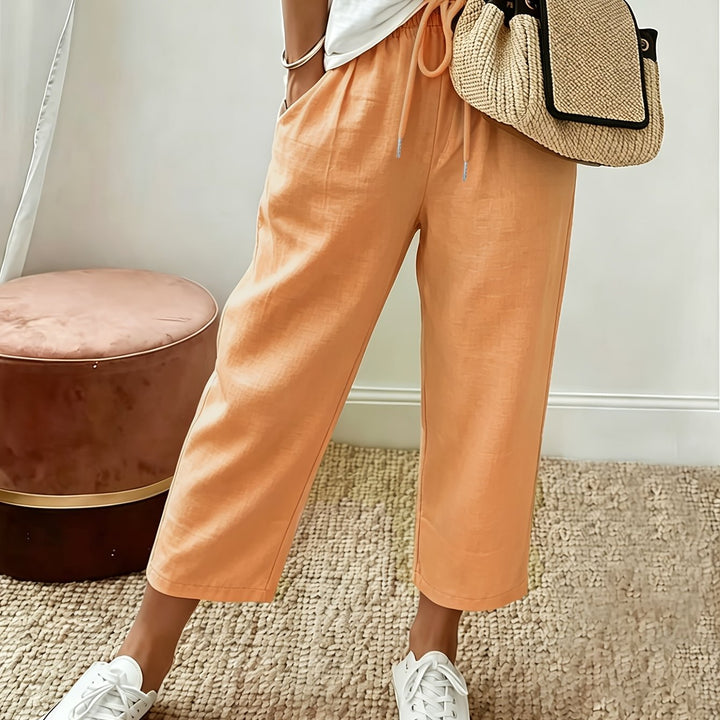 Apricot cropped wide-leg trousers with drawstring waist and ankle-length hem