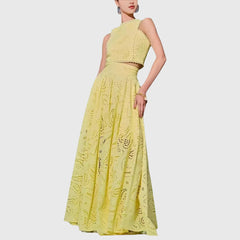Yellow two-piece set with sleeveless lace crop top and full midi skirt