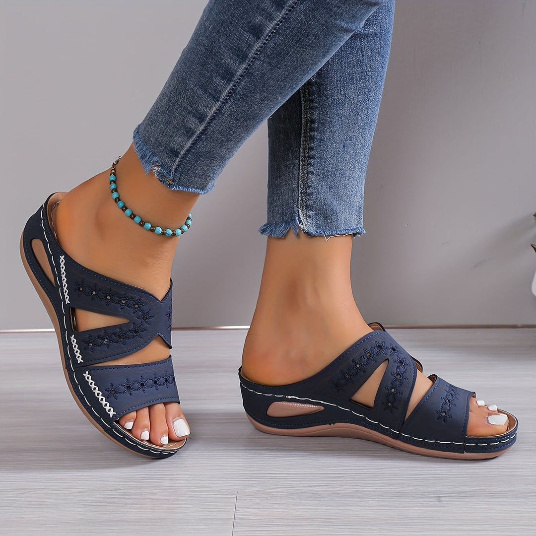 Blue orthopedic casual sandals with crisscross strap and cushioned footbed