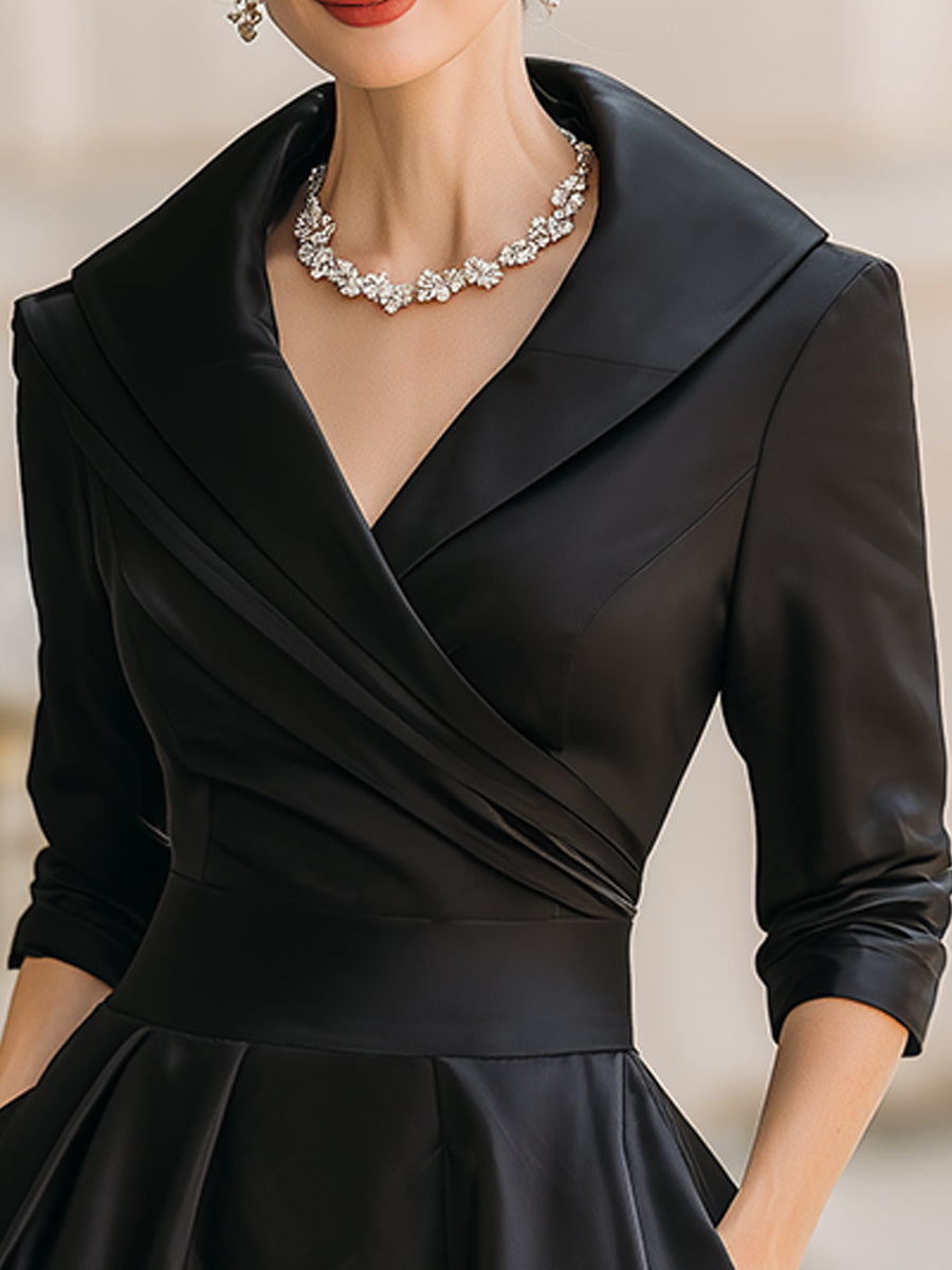 Black midi dress with V-neck wrap bodice and 3/4 sleeves