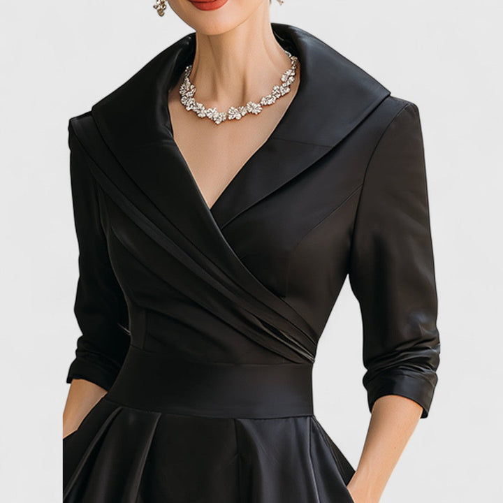 Black satin midi wrap dress with V-neck and draped waist detail.