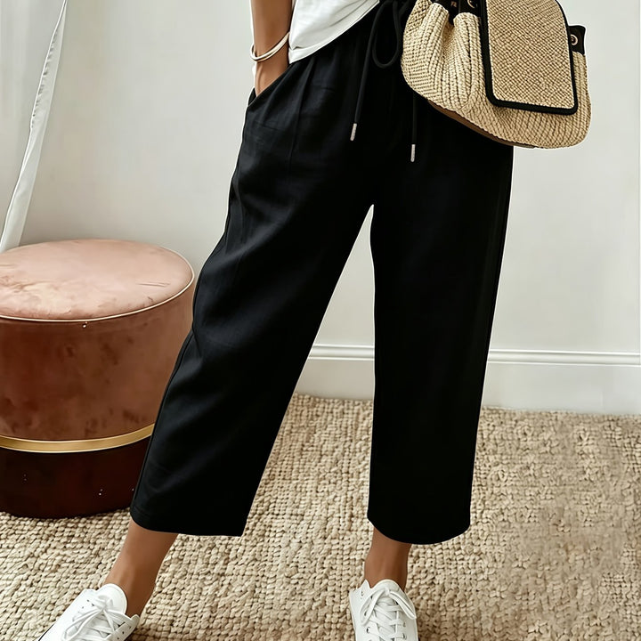 Black cropped wide-leg trousers with drawstring waist and ankle-length hem