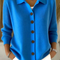 Blue button-front knit cardigan with point collar and dark buttons, long sleeves