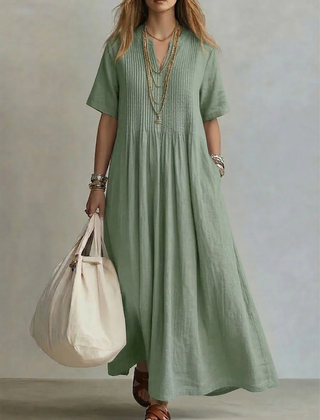 Green pleated maxi dress with short sleeves and round neckline