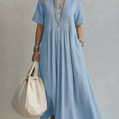 Light blue pleated maxi dress with short sleeves and round neckline