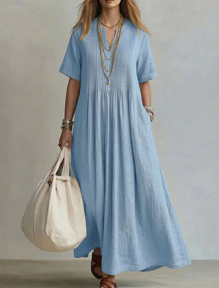 Light blue pleated maxi dress with short sleeves and round neckline